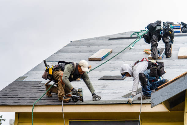 Professional Storm Damage Roof Repair technician working in Oakville, CT